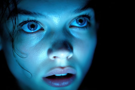 A woman with blue eyes is looking at the camera photo