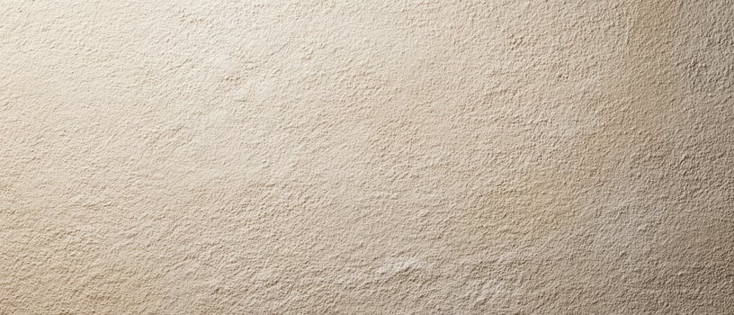 The textured beige wall showcasing natural elegance and minimalist design. photo