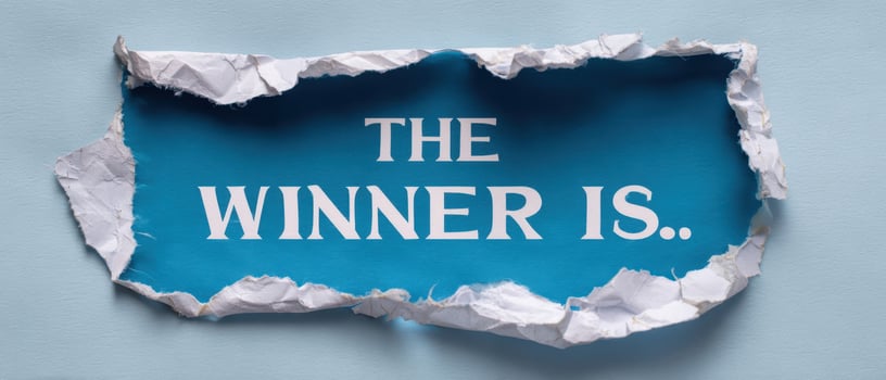 The torn paper reveals an exciting announcement for the winner of a competition. photo