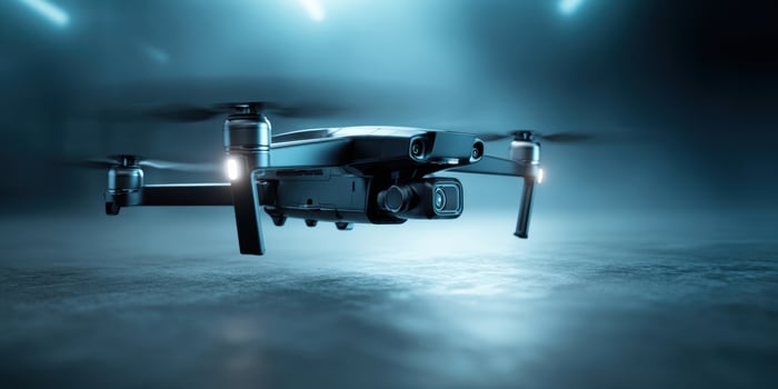 The sleek drone soaring through a modern, atmospheric setting with dim lighting. photo