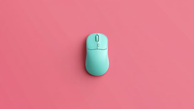 Minimalist Turquoise Wireless Computer Mouse on a Pink Background Perfect for Product Presentation and Technology Related Designs photo