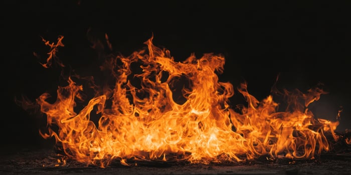 The mesmerizing flames dancing against a dark background, creating an intense visual spectacle. photo