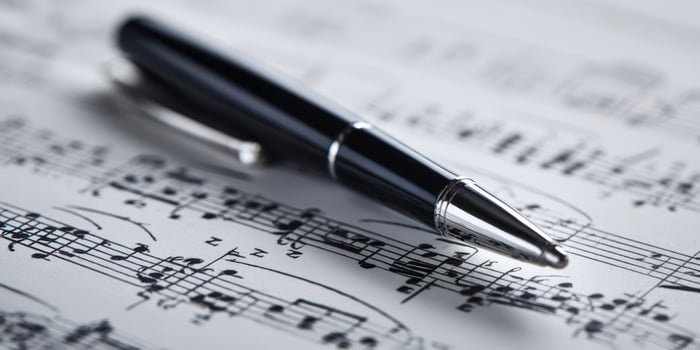 The elegant pen poised above captivating music sheet notes. photo