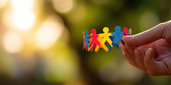 The colorful paper figures representing unity and togetherness in nature. photo