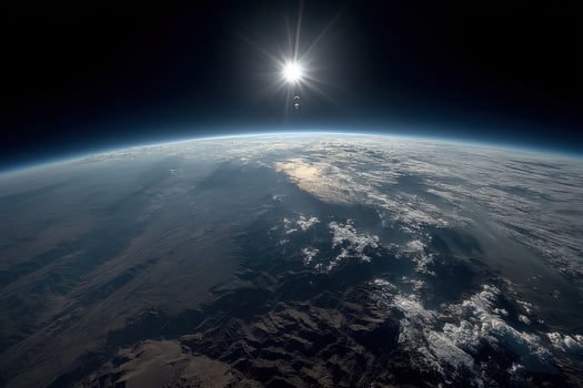 The sun shines over the earth from space photo