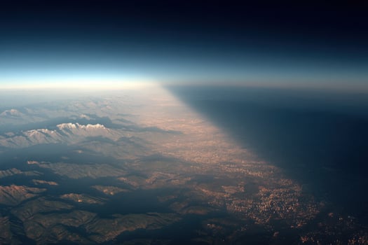 A view of the sun shining through the clouds photo