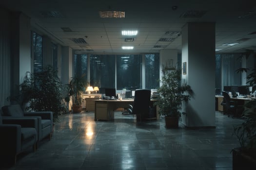 An empty office with a desk and chairs photo