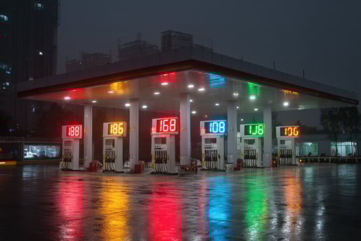 A gas station with colorful lights on it photo