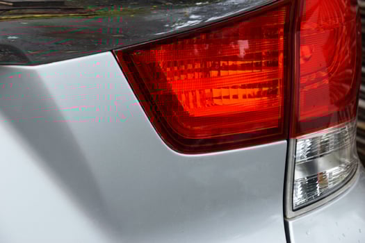 Closeup of Sleek Red and White Vehicle Taillight photo