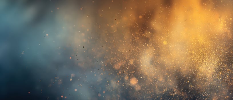 The mesmerizing shimmer of golden and blue particles in a dynamic background photo