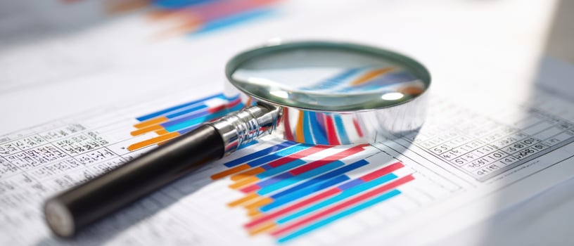 The Magnifying Glass Highlighting Business Data and Financial Analysis photo