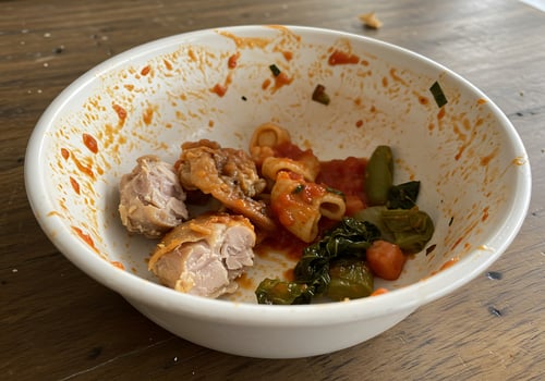 A white bowl with food in it photo