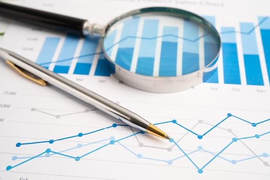 Magnifying glass data graphs photo