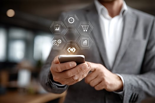 Businessman using smartphone with omnichannel technology for seamless communication and customer experience photo
