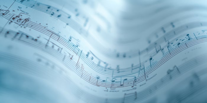 The flowing beauty of musical notes on a textured sheet of music. photo
