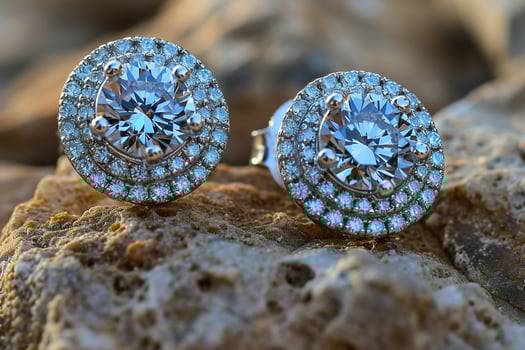 Luxury Diamond Stud Earrings Displayed on Textured Rock Surface in Golden Hour Light. photo