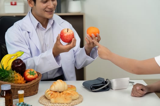 Doctor Presenting Healthy Food Choices to Patient photo
