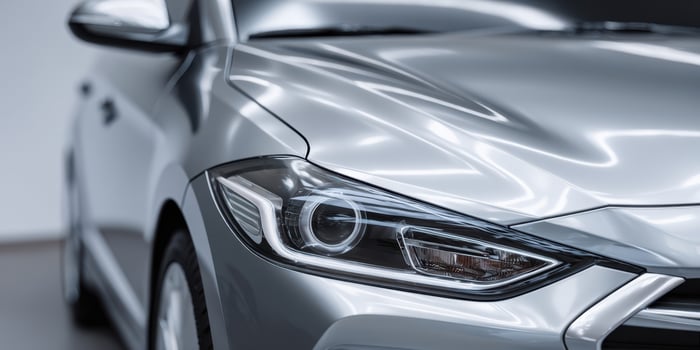 The sleek silver car showcasing modern automotive design and technology. photo