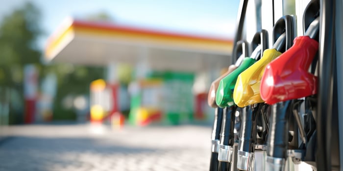 The gas pumps at a vibrant fuel station in bright daylight. photo