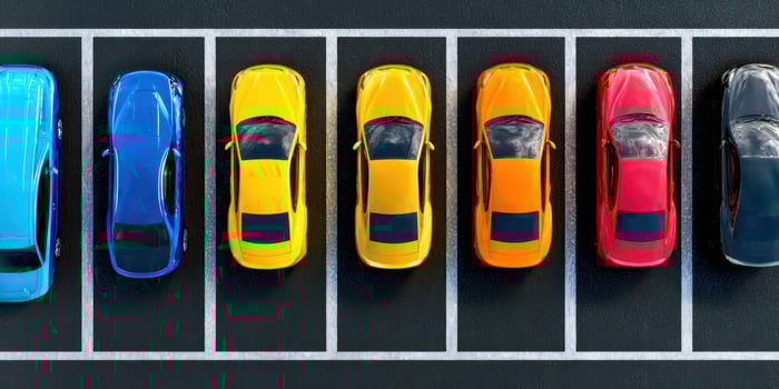 The vibrant lineup of colorful cars in a modern parking lot photo