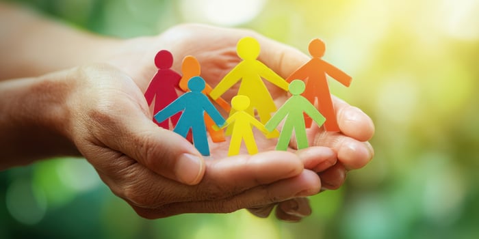 The colorful paper figures symbolizing unity and care in a nurturing environment photo