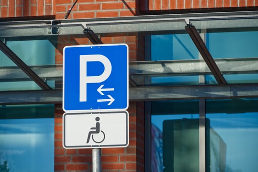 Accessible Parking Sign with Directional Arrows photo