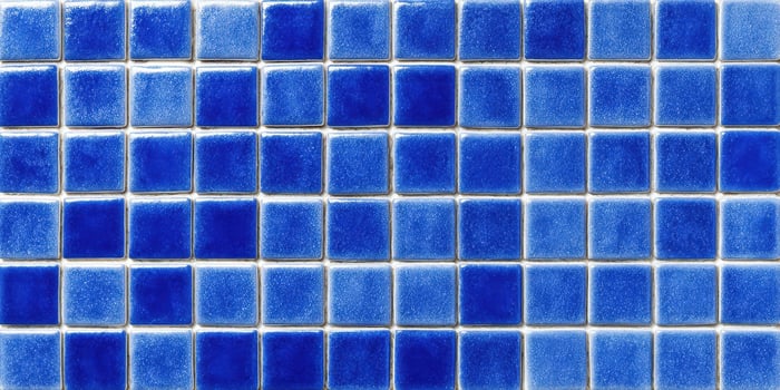 The blue ceramic tile pattern creating a stylish decorative surface. photo
