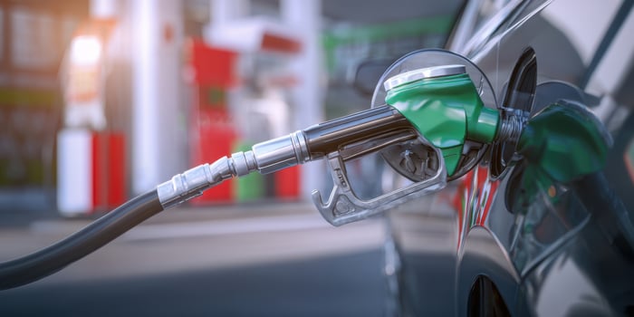 The Fuel Pump Positioned at a Modern Gas Station Refueling a Vehicle photo