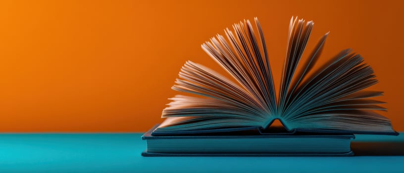 The open book revealing crisp pages against a vibrant background photo