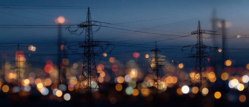 The Power Lines Against a Beautiful Urban Night Skyline with Bokeh Lights photo