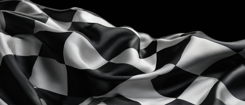 The Elegant Flow of a Checkered Racing Flag Against a Dark Background photo