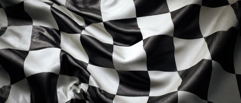 The elegant checkered flag flowing gracefully in the wind. photo