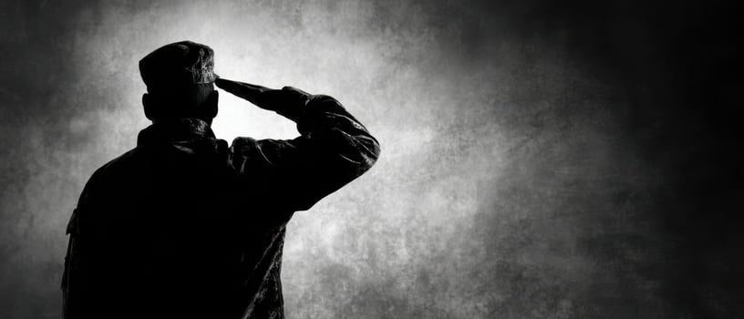 The soldier saluting in silence against a dramatic backdrop of honor and respect. photo