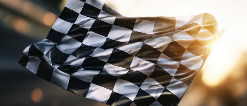 The Checkered Flag Waving in the Bright Evening Sunlight photo