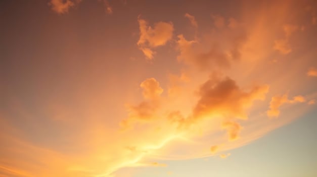 A sunset over the ocean with clouds in the sky photo