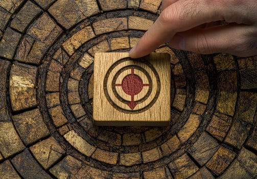 Achieve Your Goals Wooden Target Block on Rustic Background photo
