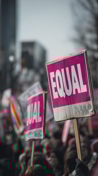 Protest signs with messages for equal rights held high during rally, showing support for equality and social justice in vibrant demonstration photo