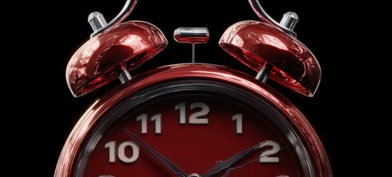 The vintage alarm clock highlighting its red hue and charming design. photo