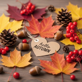 Autumnal still life with maple leaves, acorns, pinecones, and berries photo