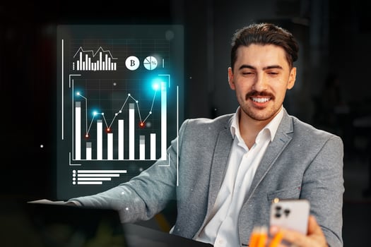Business professional analyzing financial data with digital interface in a modern office setting during late hours photo