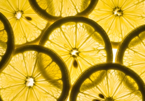 Backlit Macro of Lemon Slices with Juicy Pulp Details photo