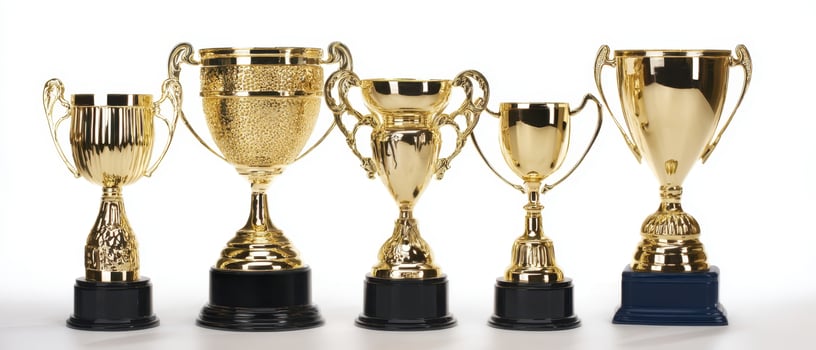 The collection of shining gold trophies symbolizing achievement and success. photo