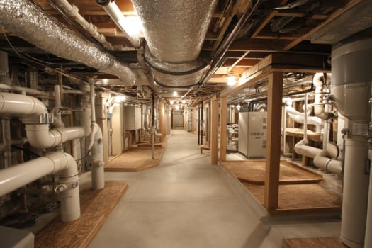 A long hallway with pipes and pipes in it photo