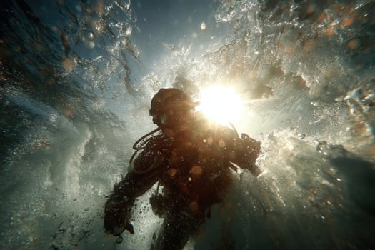 A scuba diver in the water with the sun shining photo