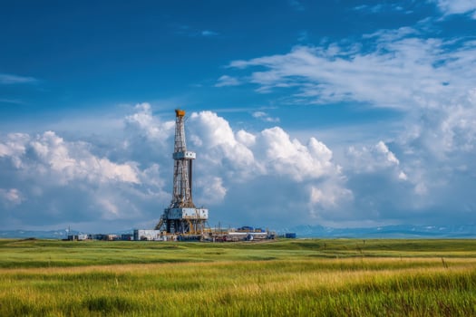 A drilling rig in the middle of a field photo