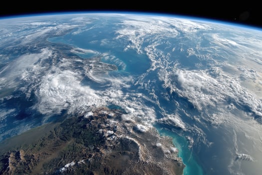 The earth from space, with clouds and mountains photo