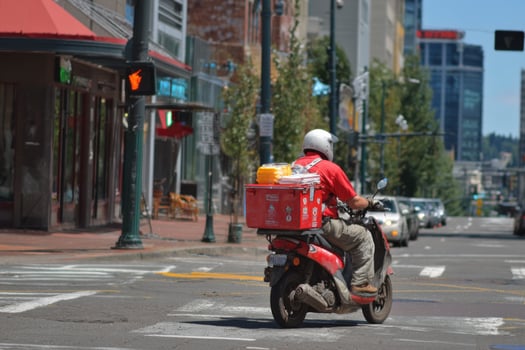 A man on a red motorcycle photo