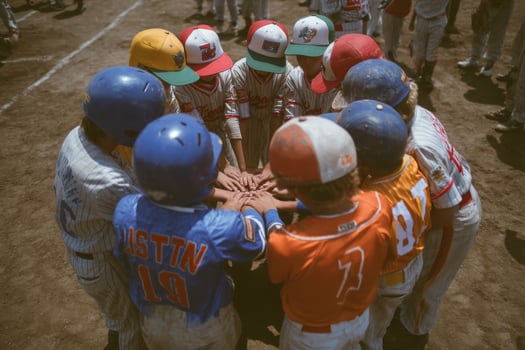 A group of young baseball players huddle together photo
