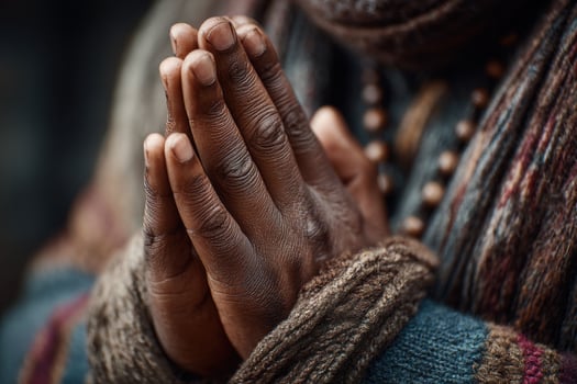 A close up of a person's hands with their hands folded photo