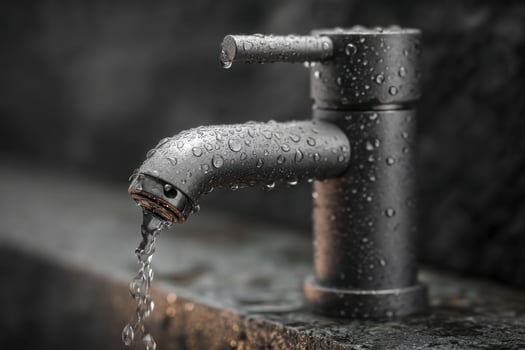 A faucet with water running out of it photo